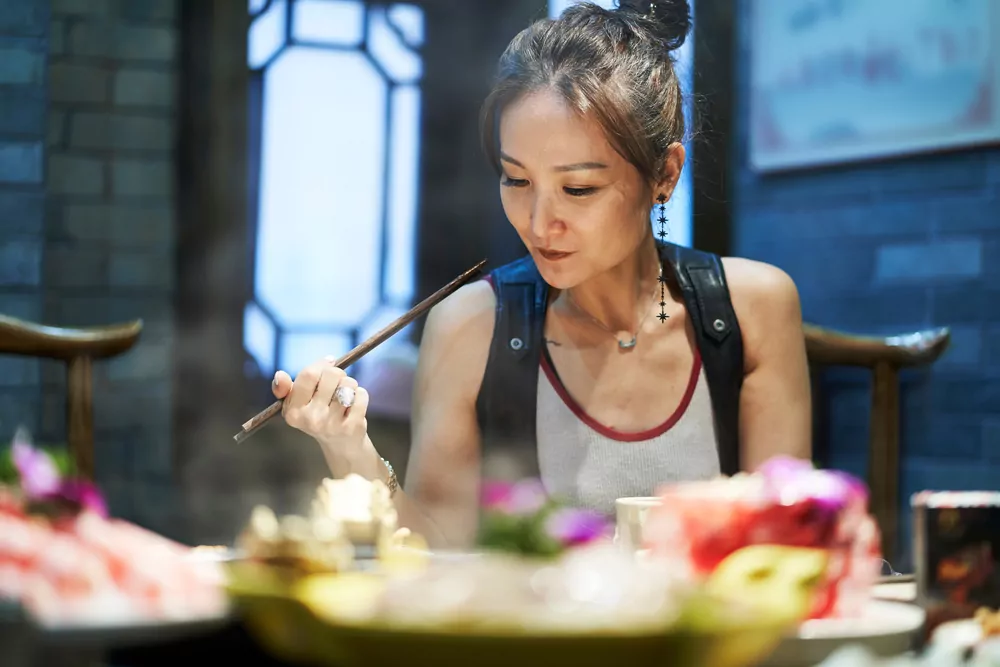 Woman at restaurant in Singapore